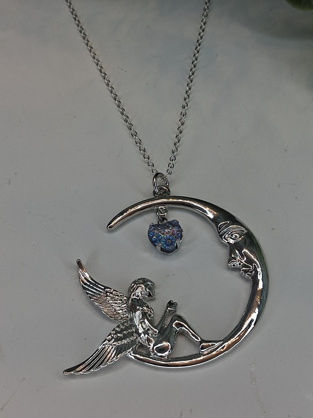 Silver Angel on Crescent Moon Necklace with Blue Heart Charm